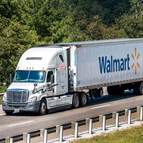 Walmart truck driving on road during day